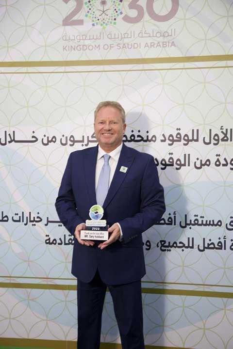 Gary Hubbard holding an award